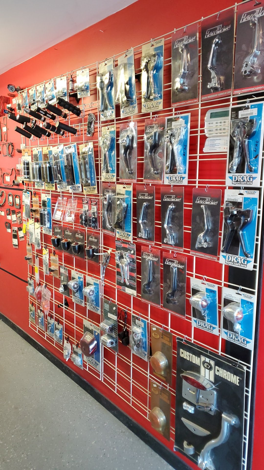 Custom chrome and accessories wall at Canyon Country Cycle